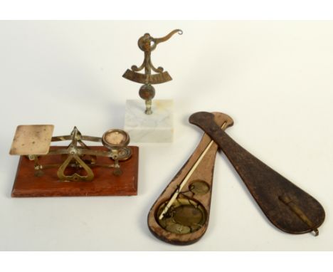 A set of postage scales and two others. 