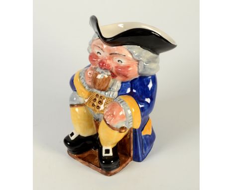 A Clarice Cliff Newport Pottery toby jug, in the form of a seated man drinking a jug of ale, height 21cm. 