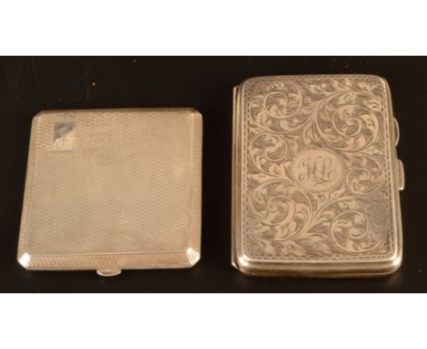 An engine turned silver compact Birmingham 1947 together with an engraved silver cigarette case Birmingham 1927. 4.6oz.