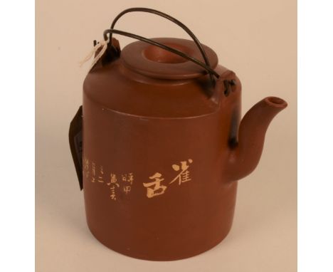 A Chinese Yixing teapot, the body with a crane amongst foliage, calligraphy and seal mark to base, height 14cm, diameter of b