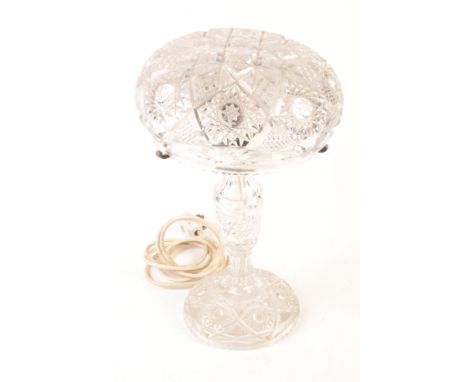 A Victorian cut glass table lamp, with silver plated mounts, height 43cm, diameter of shade 26cm, and two brass oil lamps.   