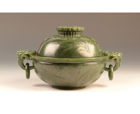 A Chinese spinach green jade two handled censer and cover of rounded form on a wide flat foot, the body carved in low relief 