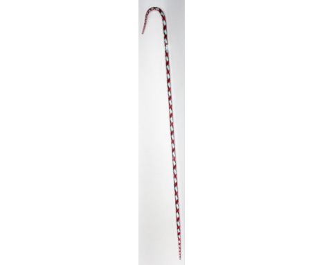 A Nailsea glass walking stick, with red spiral decoration, length 96cm. 