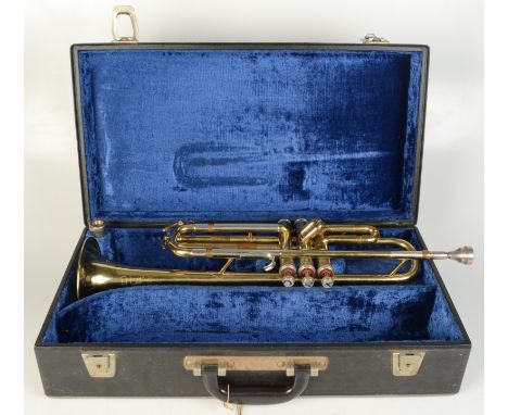 A B & M Champion brass trumpet in a fitted, blue velvet lined case, length of trumpet 55cm.