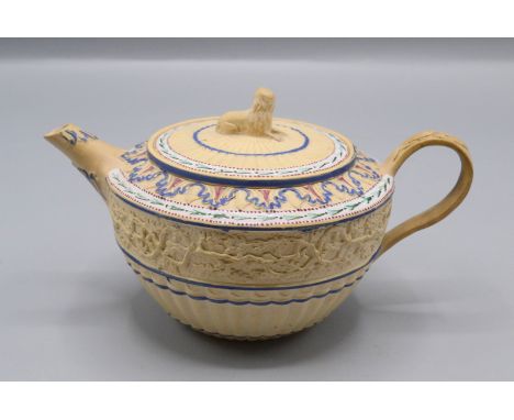 A canework teapot, circa 1800, the cover with a lion finial, the fluted body decorated with entwined branches and leaves, hei