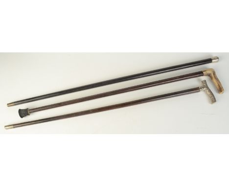 A walking stick with Chinese silver dragon decorated handle, together with an ebony walking stick with engraved silver finial