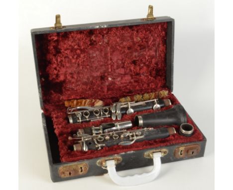 A Boosey & Hawkes Regent wooden clarinet No.127450, in fitted case. 