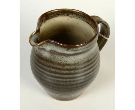 A Leach pottery jug, with a ribbed body, height 15.5cm.