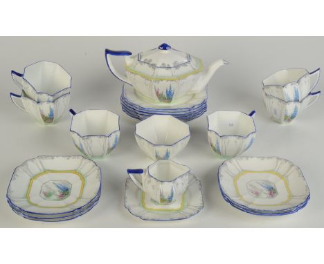 A Shelley porcelain tea service, decorated in the 'My Garden' pattern No.11607, Rd.723404, comprising a teapot, seven cups, s