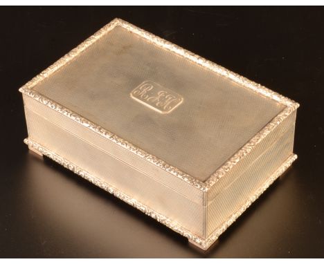 An engine turned silver cigarette box makers mark FOS, London 1935.   Condition report:  Very crisp. Very very slight dent on