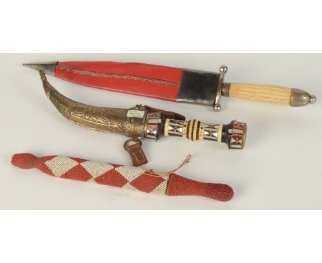 A Turkish dagger with mother of pearl and bone inlaid handle, brass scabbard, length 28.5cm, a dagger with steel engraved bla