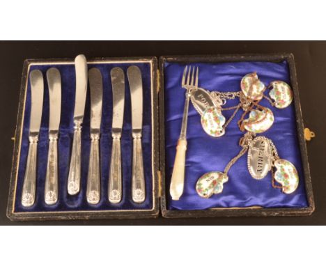 Cake knives with plated blades and filled silver handles, a Victorian silver and mother of pearl pickle fork together with va