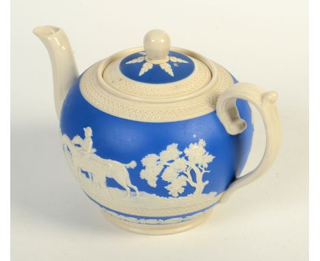 A Copeland blue and white teapot, early 20th century, decorated with a hunting scene, height 13.5cm, width 20cm.  