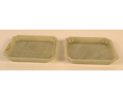 A pair of Chinese jade square trays, 8.8cm.   Condition report:  Chip along lip of one tray. Hairline crack on side of same.