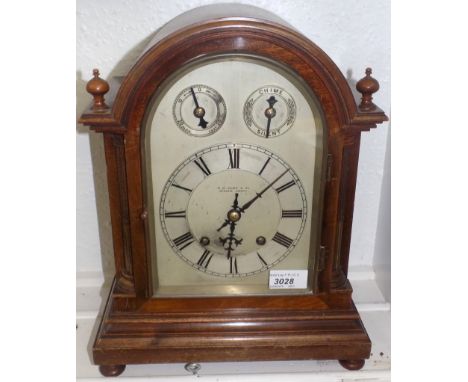 A walnut cased bracket clock, the silver dial signed W.W.Kemp & Co. Stokes Croft, the chapter ring beneath a time regulator d