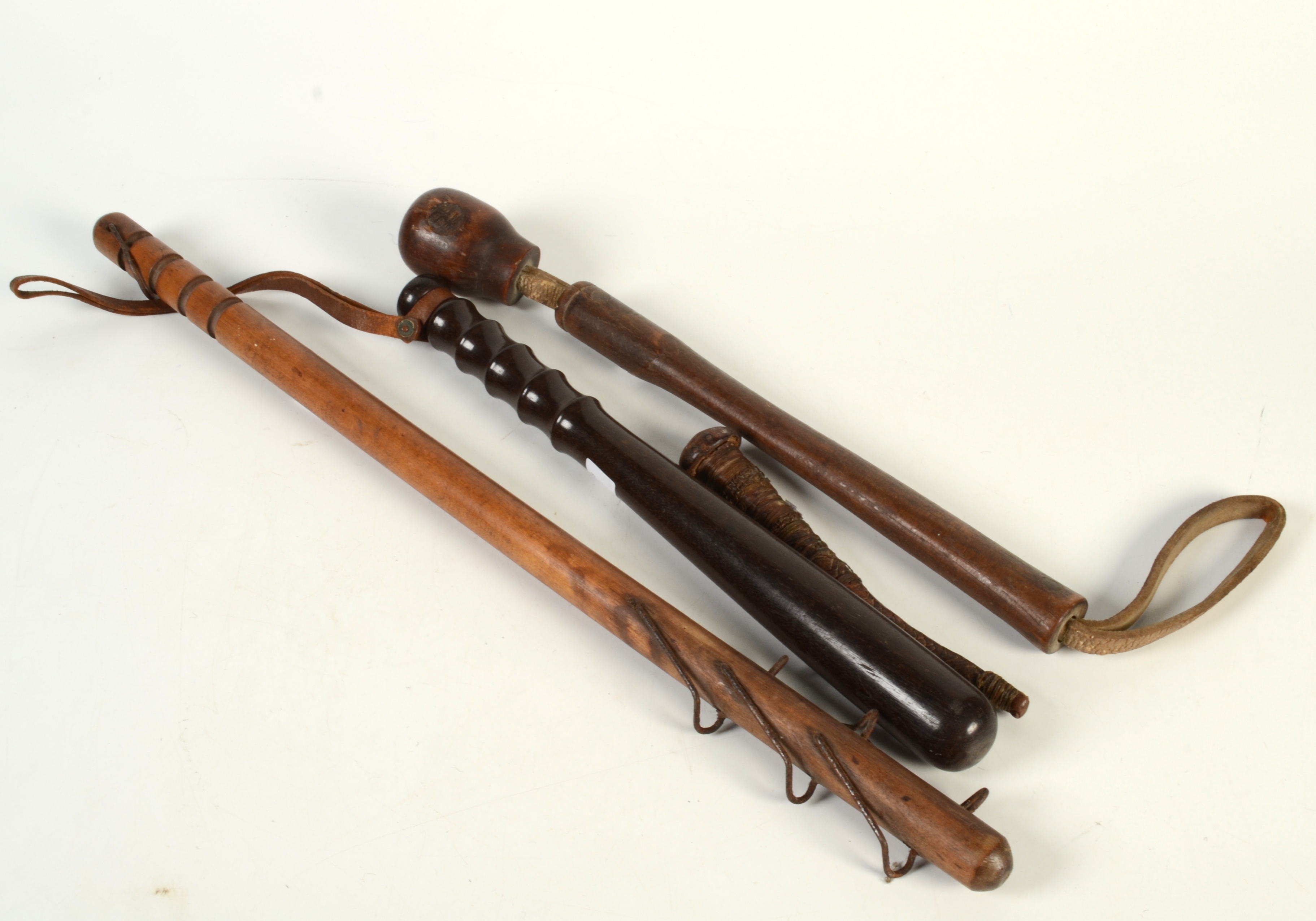 A hardwood police truncheon, length 38cm, another truncheon, length 58 ...