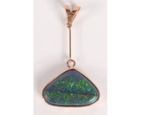 A triangular black opal in pendant mount. Condition report: Single opal.  Dark ripple through opal.  Dimensions 23mm x 15mm x