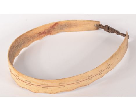 A scrimshaw bone crown formally the property of Richard Seddon of New Zealand.The strip of bone tied with sinew has a scallop