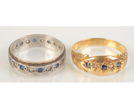 An 18ct gold ring set with sapphires, size P, together with an eternity ring, size M.