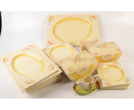 A Clarice Cliff Bizarre yellow Bon Jour Biarritz part dinner service, comprising of two tureens and covers, height 15cm, widt