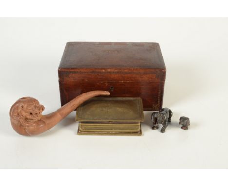 A brass snuff box, 19th century, engraved with a man on horseback, width 11.5cm, a miniature bronze figure of a bird of prey,