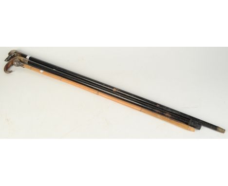 A swagger stick, the finial with CLI crowned monogram, together with a walking cane, the silver finial in the form of a dog's