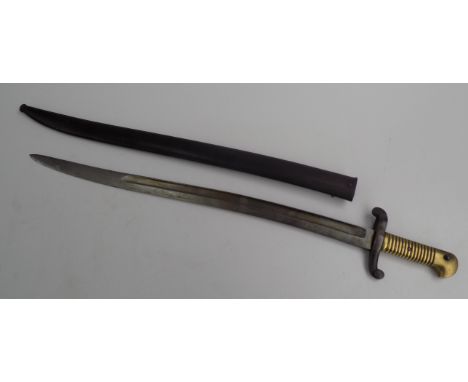 A French sabre, 19th century, the steel blade with engraved mask motif, with brass grip and metal scabbard, length 72cm.    C