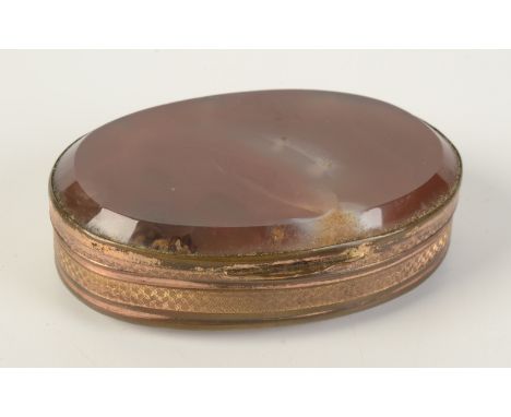 A gilt metal oval snuff box with agate lid and base. 
