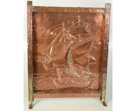A Hayle copper firescreen, embossed decoration of a galleon at sea, with brass splay feet, height 61cm, width 46.7cm, depth 1