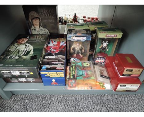 A shelf of modern collectables including Britains Zulu War 20180 Set, Side Show John Wayne Figures, Equity Marketing Headline