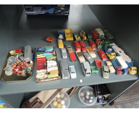 A shelf of playworn diecasts including Dinky, Corgi, Spot-On, Matchbox Lesney etc, many repaints and af, some in original con