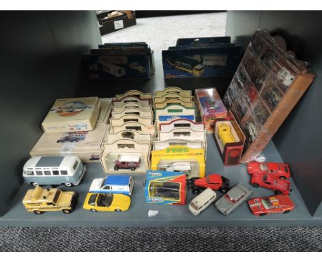 A shelf of modern diecasts including Lledo, Corgi, Matchbox etc, most boxed or on display shelf, 45+, also includes earlier C