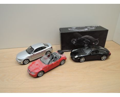 Three modern 1:18 scale diecasts, Norev Porsche 911 4S boxed, Kyosho BMW1 Series Coupe and UT Models BMW Z3