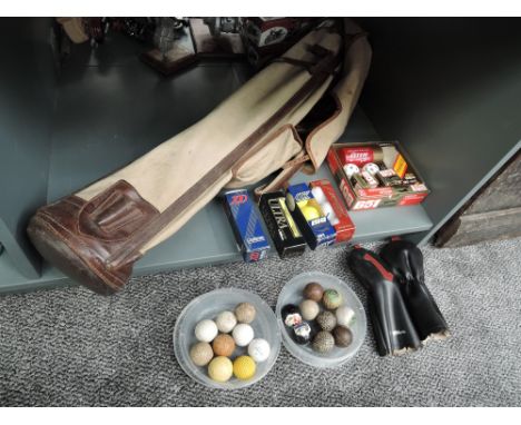 A collection of vintage Golf Accessories including canvas bag, leather woods covers, Balls including Pin Hi No2 &amp; No 3, D
