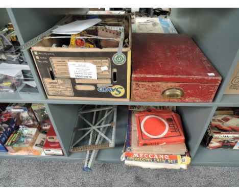 Two shelves of mixed vintage playworn Meccano including early red and green in fitted wooden box, modern Breakdown Crew Part 