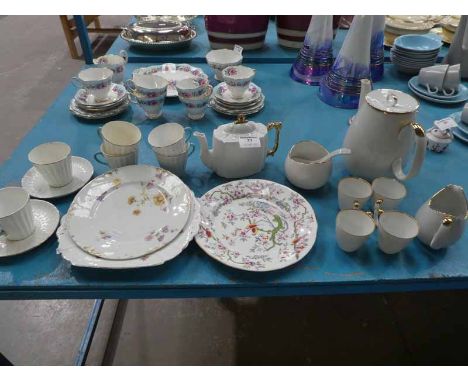 Two white and gilt part tea service and three odd plates.