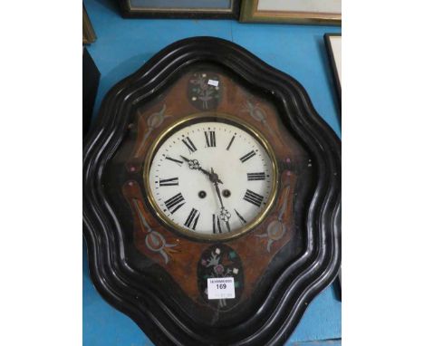 A French wall clock, oval wavey edge case, marquetry inlaid with white enamel dial, Roman numerals and striking movement.