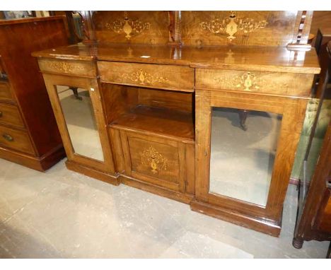 An Edwardian inlaid mahogany chiffonier with a pair of mirrored doors and low back shelf.