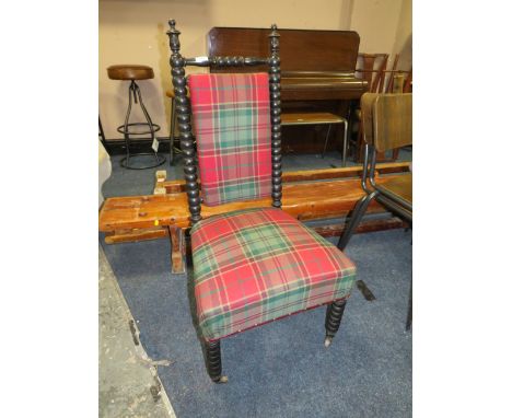 AN ANTIQUE EBONISED BOBBIN TURNED BEDROOM CHAIR WITH MODERN UPHOLSTERY