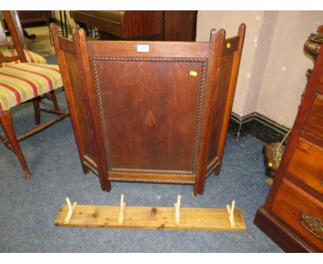 A VINTAGE OAK FIRESCREEN AND AN UNUSUAL COAT/HAT RACK, WALKING STICK...