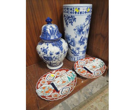 A LARGE BLUE AND WHITE STICK STAND TOGETHER WITH A LARGE BLUE AND WHITE TEMPLE JAR WITH COVER AND A PAIR OF OVAL IMARI PLATTE