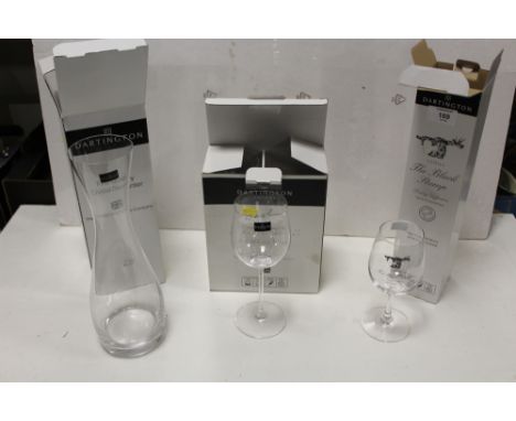 THREE BOXED DARTINGTON CRYSTAL GLASSWARE ITEMS TO INCLUDE A DECANTER AND WINE GLASSES