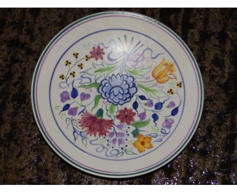 A Poole painted plate.