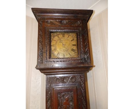 A brass dial bell striking 30 hour carved oak longcase clock, the 10” square dial inscribed 'Avenell, Farnham', 83” high.