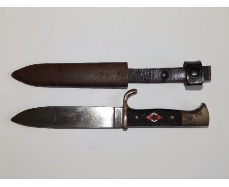 A Hitler Youth dagger in metal scabbard, the 5.5” 'Puma' blade marked 'RZ' Solingen, enamelled Swaztika lozenge to chequered 