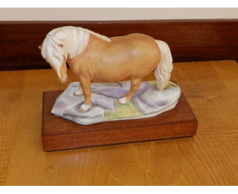 A Royal Worcester Limited Edition Shetland Pony on wooden stand with certicate by Bernard Winskill, No. 27.