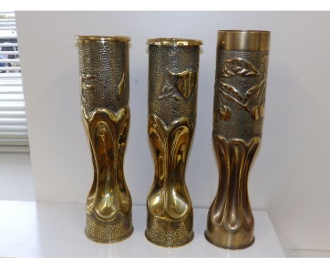 A French WWI trench art shell case engraved with the Cross of Lorraine and two others. (3)