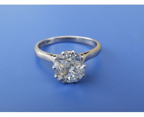 A cushion cut diamond solitaire ring, the claw set stone weighing approximately 1.5 carats in 18ct &amp; PLAT white metal.