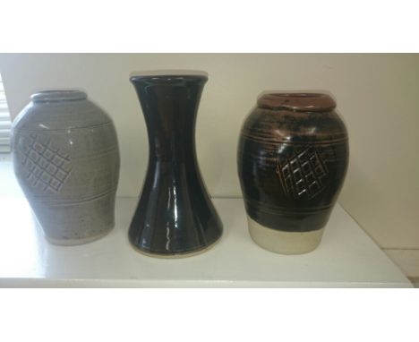 Three Jeremy Leach pottery vases.