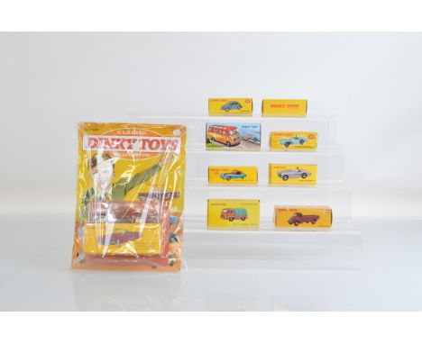 Eight boxed Atlas Editions Dinky Toys, including  104, 157, 181, 262 Swiss Postal VW, 412, 541 Mercedes Benz Bus,  546 Austin